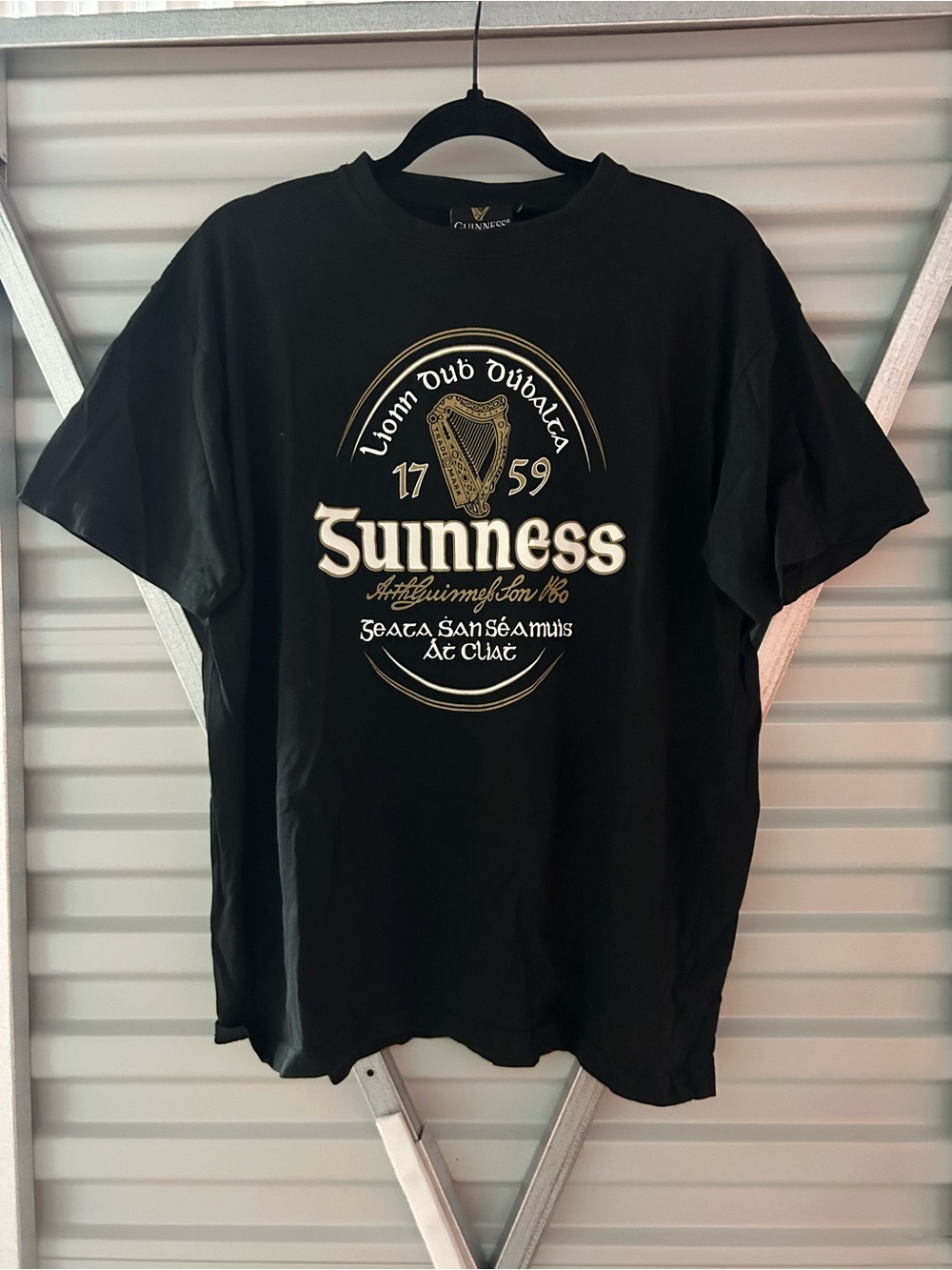 Guinness Black Tee with Gold and Cream Crest Graphic